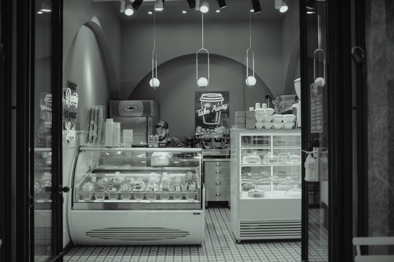 Tatte bakery interior with warm lighting and fresh pastries